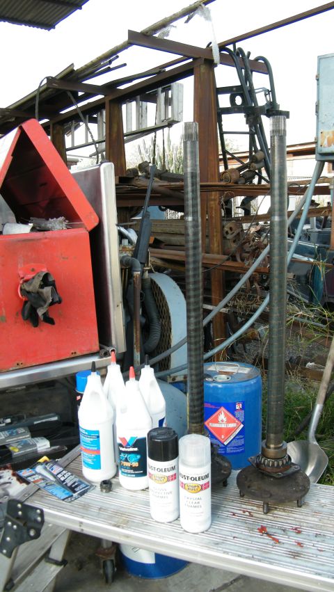 1982 Ford Bronco - Axle shafts and differential components are laid out on a workbench, suggesting preparation for installation or repair.