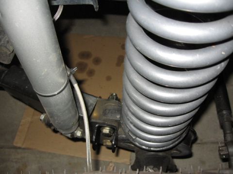 1995 Ford Bronco - Suspension components including a coil spring and shock absorber are visible in this close-up shot.