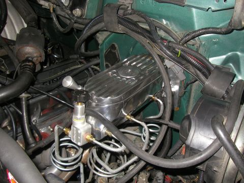1990 Ford Bronco - Engine compartment with polished finned valve cover, plumbed brake proportioning block, braided lines and green firewall.