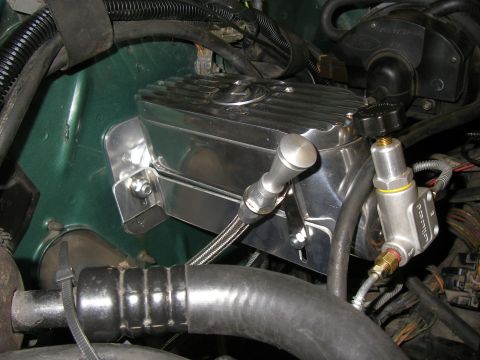 1990 Ford Bronco - Close-up of a chrome brake master cylinder assembly, likely an aftermarket part.
