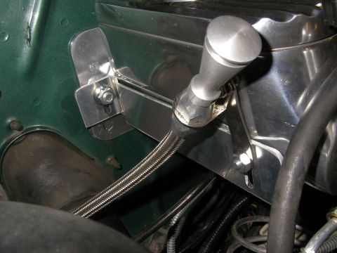 1990 Ford Bronco - Close-up of a custom master cylinder reservoir and lever assembly with braided brake line.