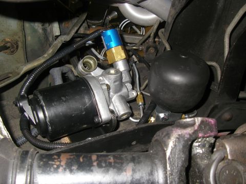 1990 Ford Bronco - This photo shows a close-up view of a vehicle's ABS brake booster pump assembly.