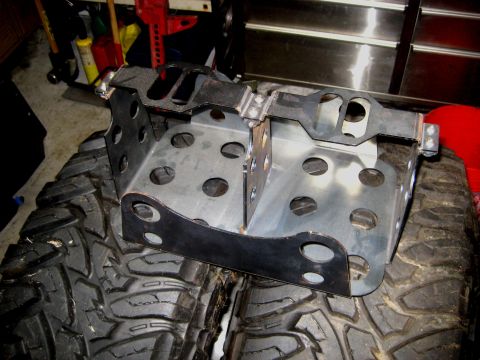 1996 Ford Bronco - Custom metal fabrication is shown resting on off-road tires, likely for an automotive application.
