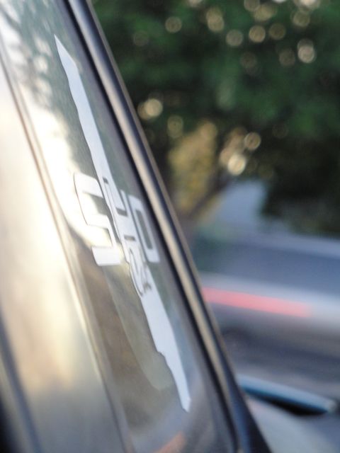 1995 Ford Taurus - A sticker with the letters 'SHO' is visible on the window of a vehicle.