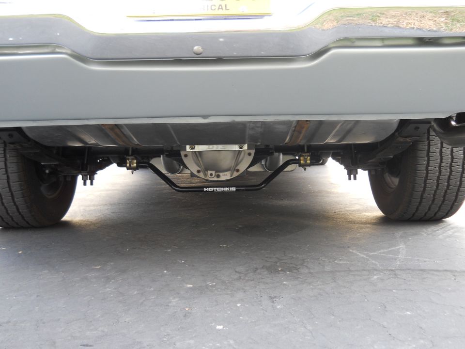 Underside view of a vehicle's rear axle and suspension with a Hotchkis sway bar