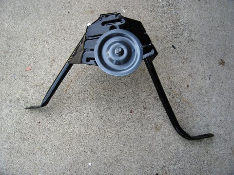 1986 Ford Bronco - This is a tire carrier roller assembly, likely for an older SUV or truck.