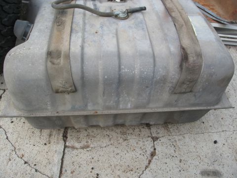 1986 Ford Bronco - Fuel tank with straps and fuel line, possibly for a truck or SUV.