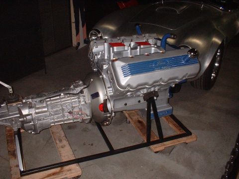 1965 Shelby Cobra - Ford 427 SOHC engine and transmission assembly displayed separately from the vehicle.