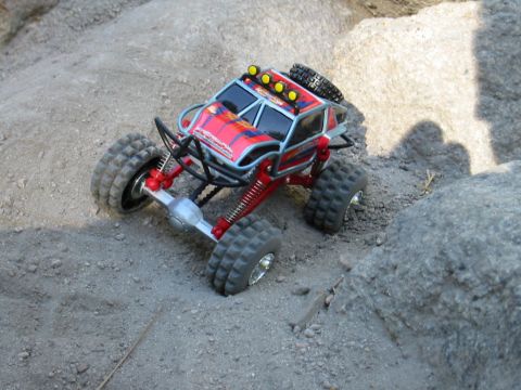 1985 Ford Bronco - A remote control rock crawler navigates a rocky terrain.