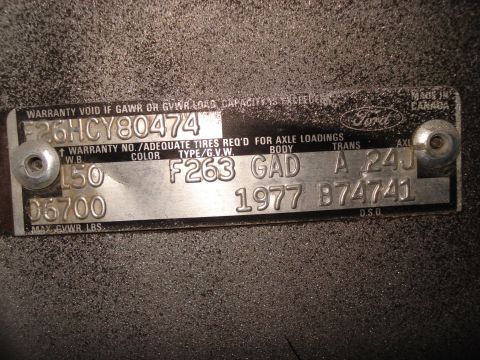 1977 Ford F-150 - VIN plate from a 1977 Ford vehicle, including model year and identification codes.
