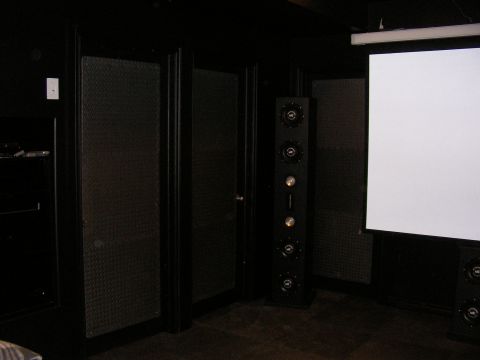 1987 Ford Bronco - A home theater setup is shown with a large projection screen and audio equipment.