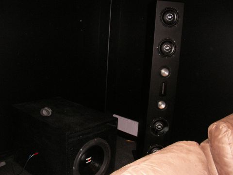 1987 Ford Bronco - A home theater setup with a subwoofer and a vertical speaker array is visible.