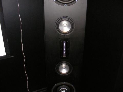 1987 Ford Bronco - A close-up view of a black speaker cabinet several audio drivers and a distinctive illuminated vertical element.
