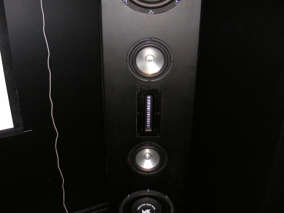 Black speaker with multiple drivers and a vertical light bar
