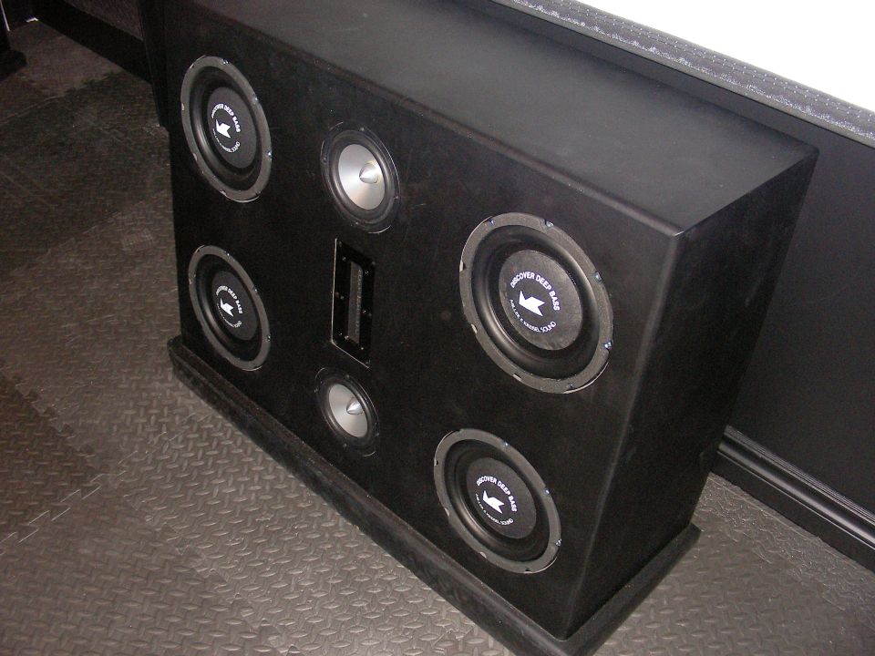 Black box with six speakers, four large subs and two smaller ones, plus a vent