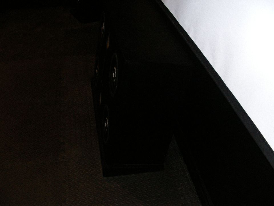 Black interior speaker grille with visible screws