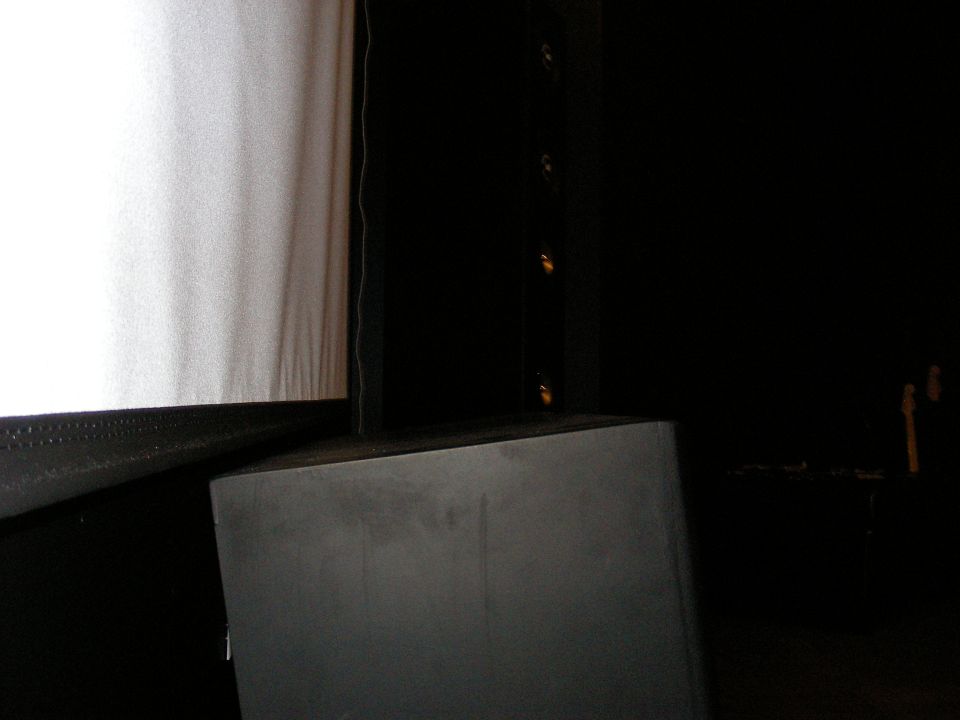 theater screen and speaker system in a dark room
