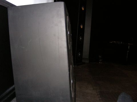 1987 Ford Bronco - A large speaker cabinet is visible in the foreground, with other audio equipment in the background.
