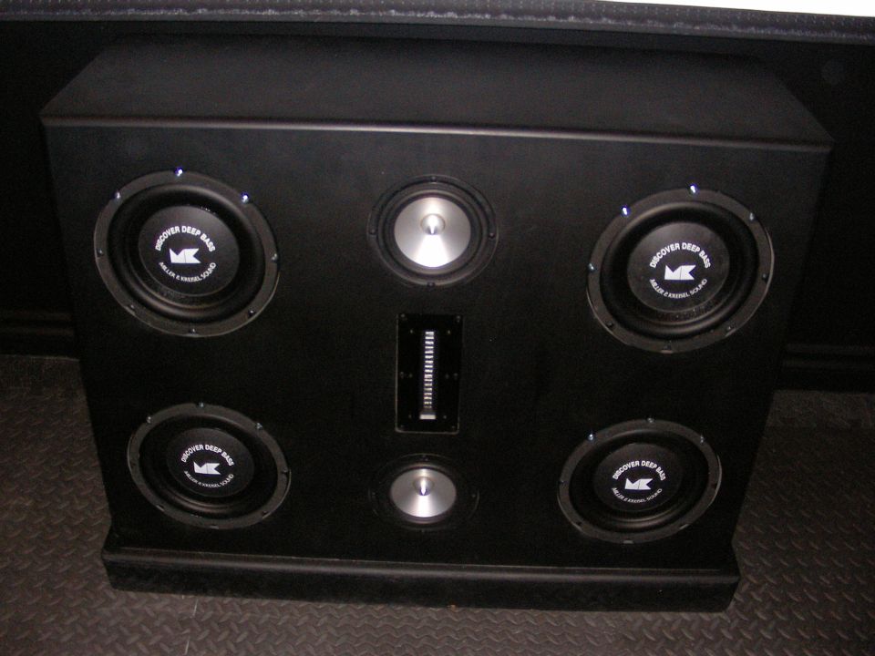 Black speaker enclosure with six speakers and a vertical equalizer