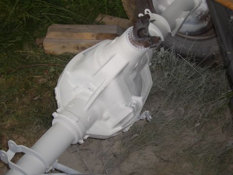 1992 Ford F-150 - A white painted rear axle assembly is shown outdoors, resting on the ground.