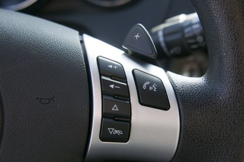 2006 Cadillac STS - The steering wheel features audio controls, a call button, and paddle shifters.