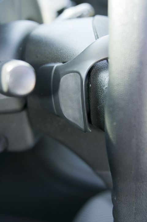 2006 Cadillac STS - A close-up view of a vehicle's interior shows a paddle shifter on the steering column.