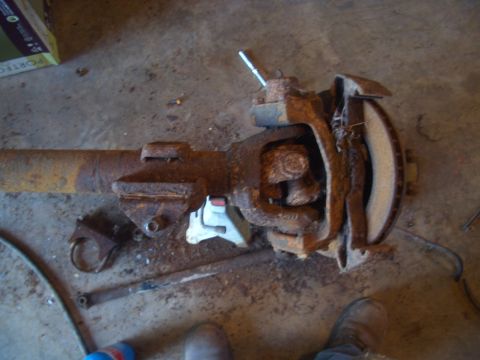 1992 Ford F-150 - Close-up of a corroded truck axle part, showing significant rust and wear on the brake components.