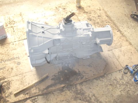 1992 Ford F-150 - A transmission is shown on a workbench, ready for installation or repair.