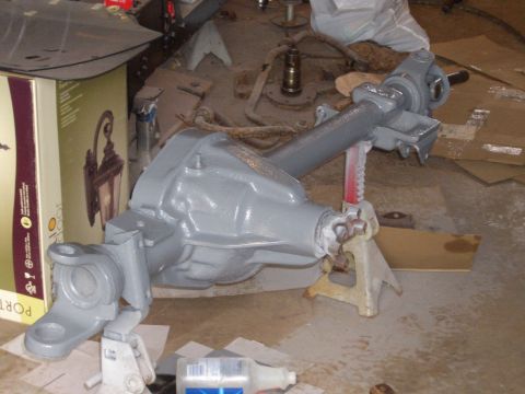 1992 Ford F-150 - A gray painted rear axle assembly is shown supported by jack stands in a workshop environment.