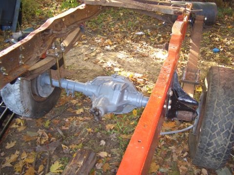 1992 Ford F-150 - The underside of a truck chassis shows a rear axle assembly and frame components.