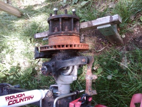 1992 Ford F-150 - Front axle assembly with brake rotor and hub, a Rough Country shock absorber. The registry claims it is a 1992 Ford F-150, but this is unco…