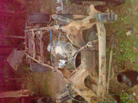 1992 Ford F-150 - The chassis and suspension of a 1992 Ford F-150 are visible, with some engine components attached.