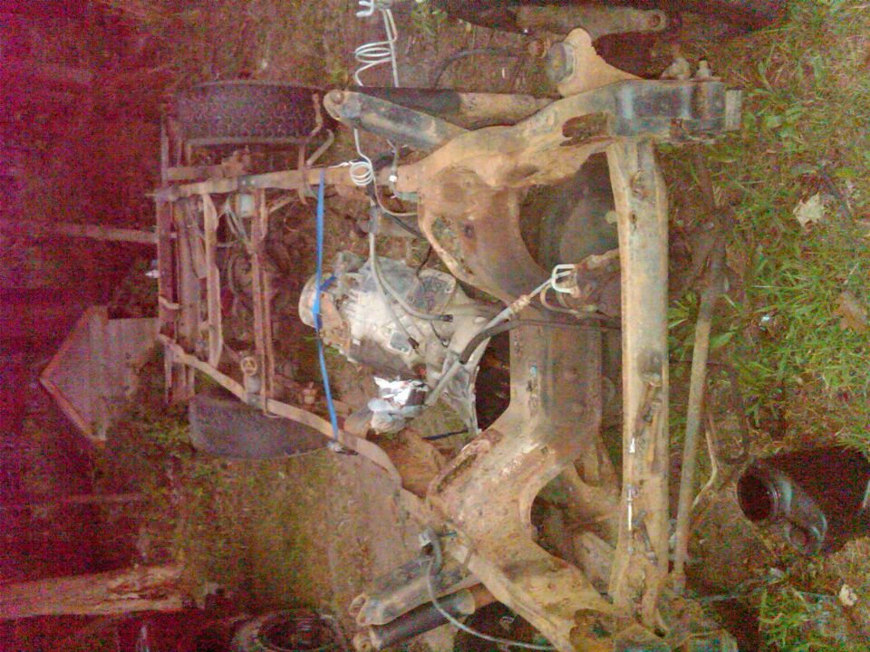 1992 Ford F-150 chassis with suspension components and engine parts, viewed from above and to the side