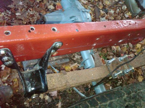 1992 Ford F-150 - This image shows a close-up view of a vehicle's frame and suspension system, including a leaf spring and various bolts and brackets.