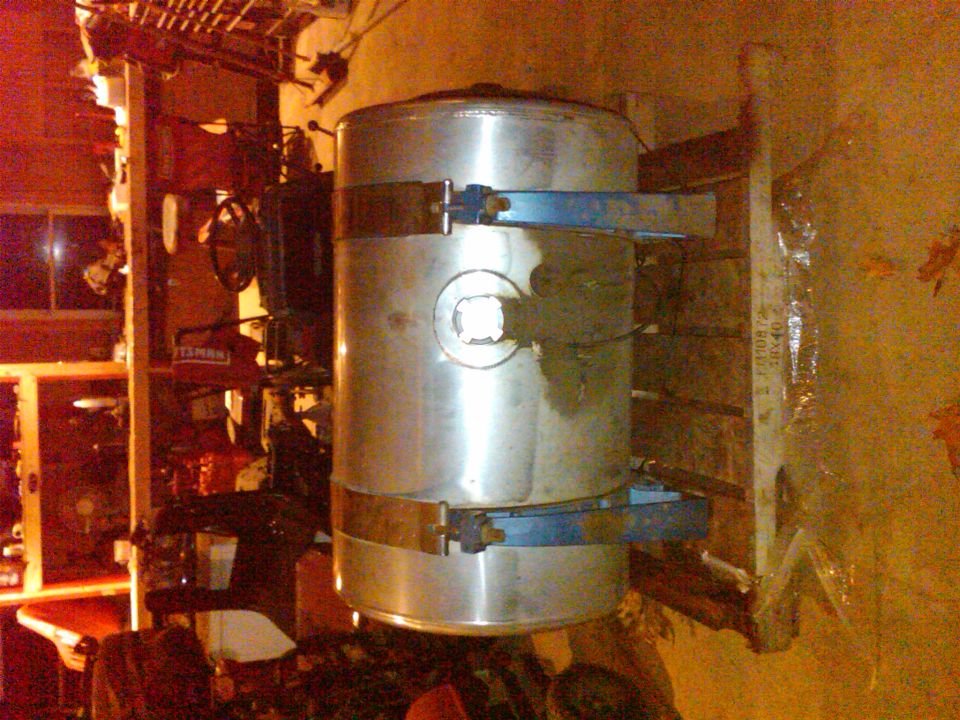aluminum fuel tank mounted with blue straps