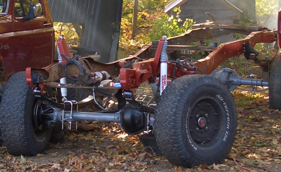 1996 Ford Bronco frame with suspension components and tires visible