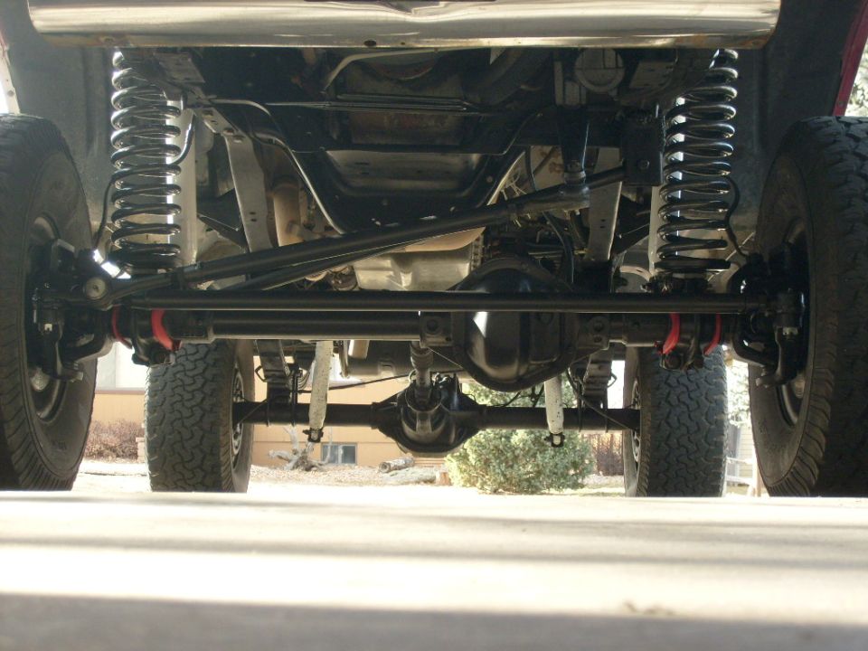 Underbody view of a 1986 Ford Bronco showing suspension and drivetrain components