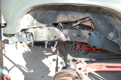 1982 Ford Bronco - Close-up of vehicle frame and suspension components during maintenance or repair.