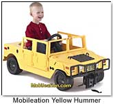 1991 Ford LTD Crown Victoria - A child happily plays in a yellow toy Hummer, with a website address visible on the windshield.