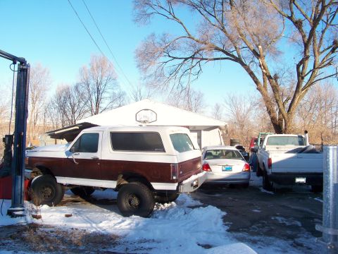 1987 Ford Ranger - Three vehicles, including a lifted Ford Bronco, sit in the snow on a clear winter day.
