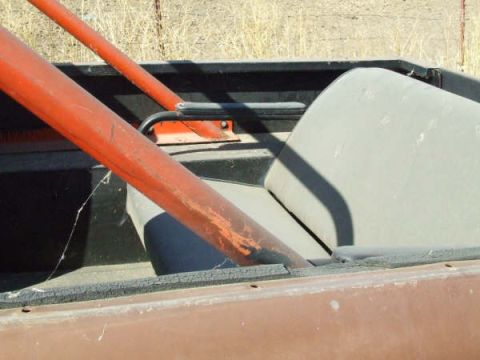 1961 International Scout 800 - Close-up of a vehicle's interior, showing a roll bar and a seat.