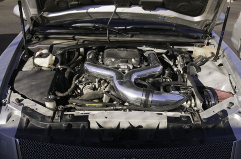 2006 Cadillac STS - The engine bay of a car is shown with the hood open, highlighting a custom intake system.