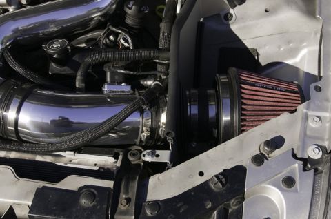 2006 Cadillac STS - Close-up of an engine bay showing a Spectre air filter and chrome intake piping.