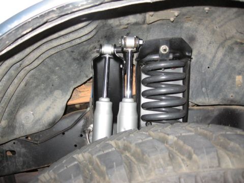 1995 Ford Bronco - so my original shock position in the ford tower leaves about 5 inches up travel, close to 9 down. The new one right next to the coil is a l…