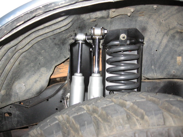 so my original shock position in the ford tower leaves about 5 inches up travel, close to 9 down.  The new one right next to the coil is a little more at 5.25 up, this was planned, wanted a little more right at the coil.