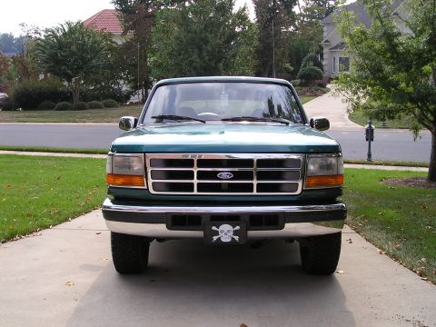 1996 Ford Bronco - This 1996 Ford Bronco is presented in a front-facing view, a chrome grille and a decorative skull and crossbones license plate frame.
