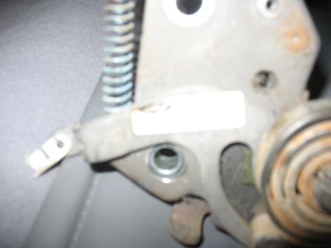 1995 Ford Bronco - This image shows a close-up of a seat adjustment mechanism, likely from the driver's side, springs and metal components.