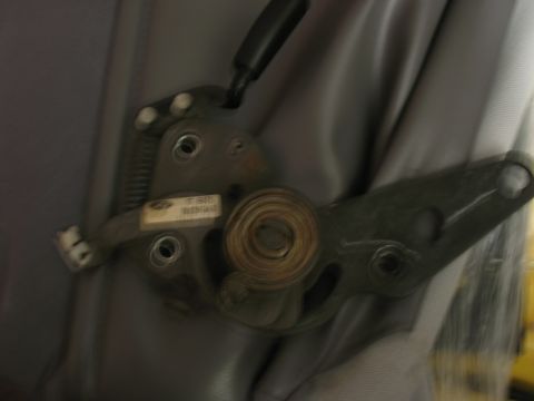 1995 Ford Bronco - Close-up of the driver seat adjustment mechanism in a 1995 Ford Bronco.