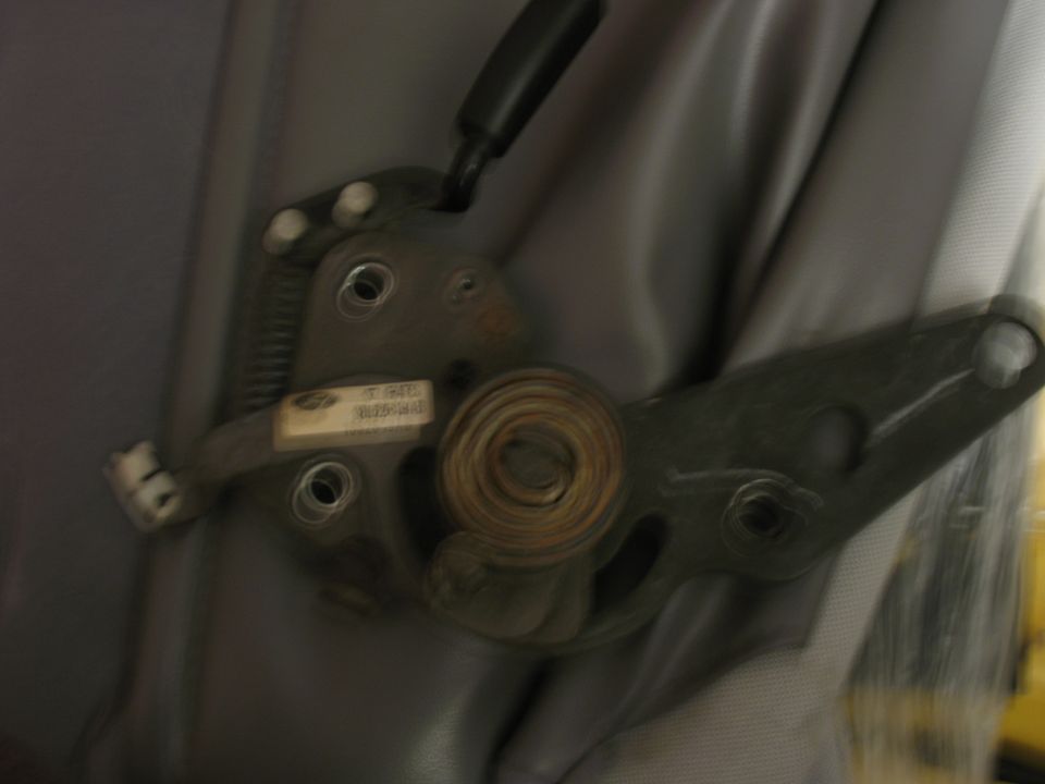1995 Ford Bronco driver seat adjustment mechanism with a small white label
