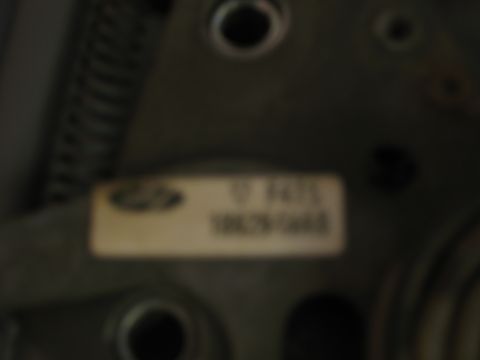 1995 Ford Bronco - A close-up shot shows a label with a Ford logo and alphanumeric characters.